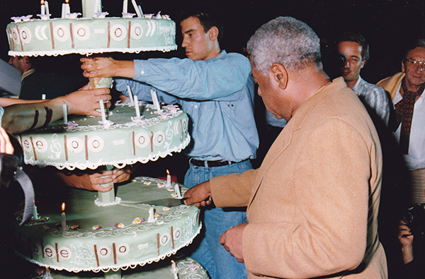 Dizzy Gillespie cutting a birthday cake